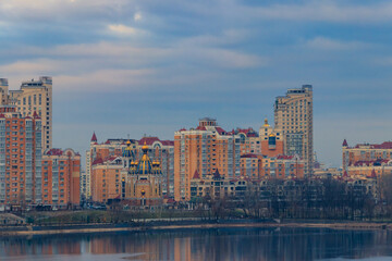 View of Obolon embankment of the Dnieper river and church of the Nativity of Christ in Kiev, Ukraine