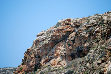 Wall of roccks and the blue sky. Lampedusa, summer 2009.