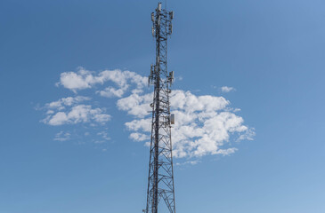 Cell phone data transmission tower on blue natural background