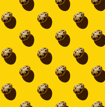 Quail egg on yellow background Pattern
