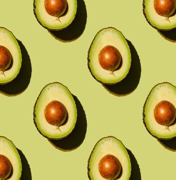 Avocado on green background Pattern