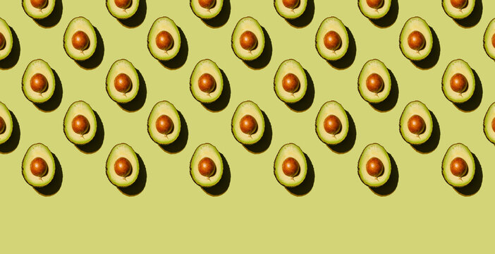 Avocado on green background Pattern