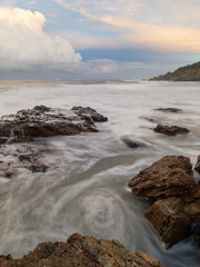 Water flowing between rock formation.