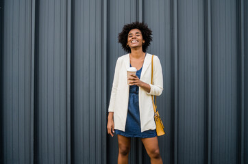 Fototapeta na wymiar Portrait of afro business woman outdoors.