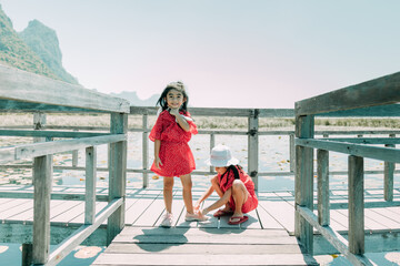 Two Little girls tying the laces 