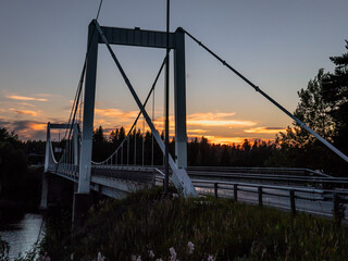 Obraz premium Bridge of Kirkonvarkaus in Mikkeli, Finland. Beautiful sunsetnon background.
