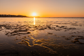 Sunset on the sandy beach. Egypt. Coast of the Red Sea. Summer holiday