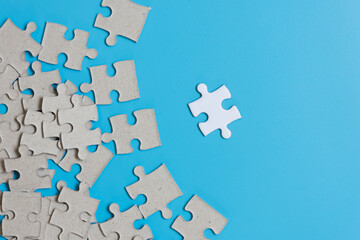  Jigsaw puzzle on blue background,contrast concept.
