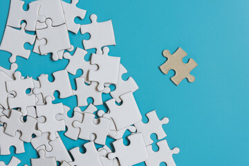  Jigsaw puzzle on blue background,contrast concept.