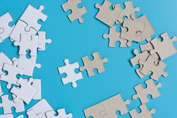  Jigsaw puzzle on blue background,contrast concept.