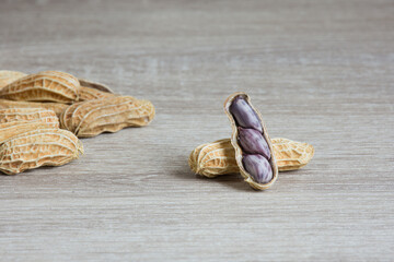 Group of peanut on wooden table background,copy space.