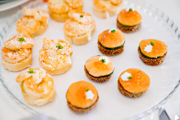 canapes. A convenient buffet feed. little sandwiches at the festival. Catering. delivery of ready meals and service of banquets.