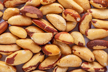Pile of peeled Brazil nuts as texture background. Healthy vegetarian snacks. Protein-containing food.