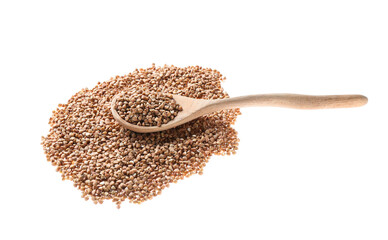 Spoon with dry buckwheat on white background