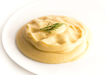 Isolated mashed potatoes on the white plate.