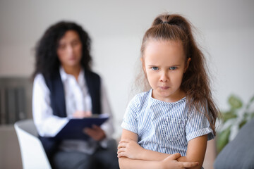 Displeased little girl at child psychologist's office