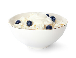 Bowl of cottage cheese with blueberries on white background
