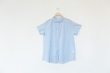 Woman blue blouse with summer blouse cotton on white background.
