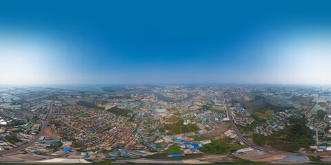 360 panorama by 180 degrees angle seamless panorama of aerial view of buildings with curve of Chao Phraya River. Samut Sakhon skyline near Bangkok, Urban city in downtown area at noon, Thailand.