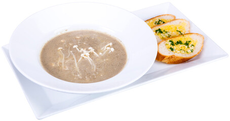 Mushroom cream soup with grilled brad on the whiter plate, food, white background.