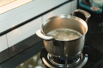 Boiling hot water soup in stainless steel pot