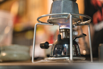 Brewing espresso coffee by Italian Moka pot gas stove