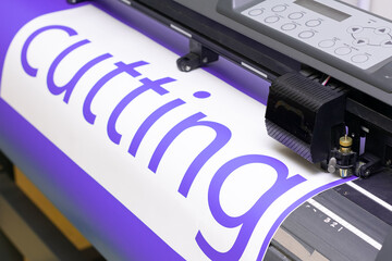 Cutting plotter close-up. The process of cutting a vinyl film