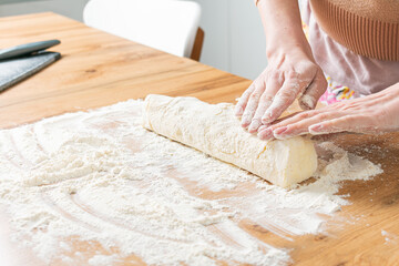 A woman prepares homemade cakes. Dough preparation