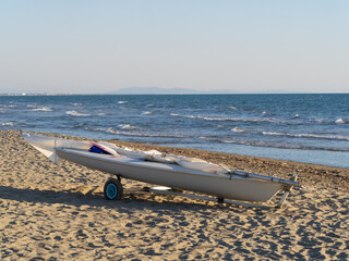 small sailing boat on a cart on the beach