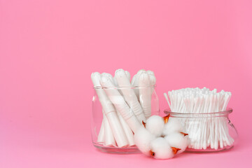 Cotton tampons and ear buds on paper background