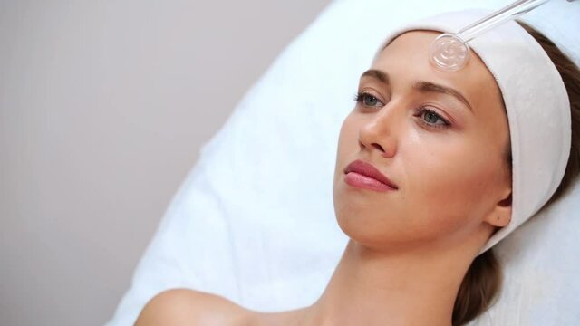 Darsonval cosmetology apparatus. Face clean procedure. Salon treatment. Professional dermatology hardware. Electric equipment. Medicine device. Removal acne. Dermatology. Detox therapy. Rejuvenation