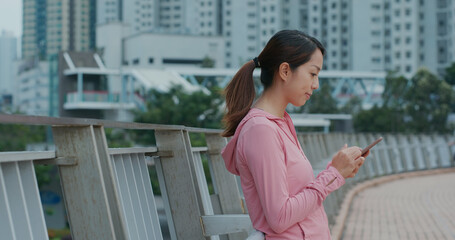 Fototapeta premium Woman use of cellphone at outdoor