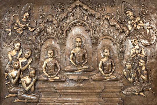 Buddha statues on temple wall in Thailand tell the story about the Buddha's history