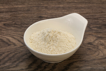 Wheat flour heap in the bowl