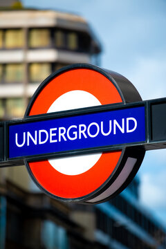 London, UK. 27th March 2021. The famous and iconic London Underground tube station sign. This wall mounted version is located at Waterloo Station and proudly shows the red roundel with blue bar.