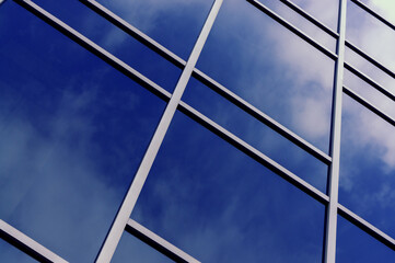 background sky reflected in glass building