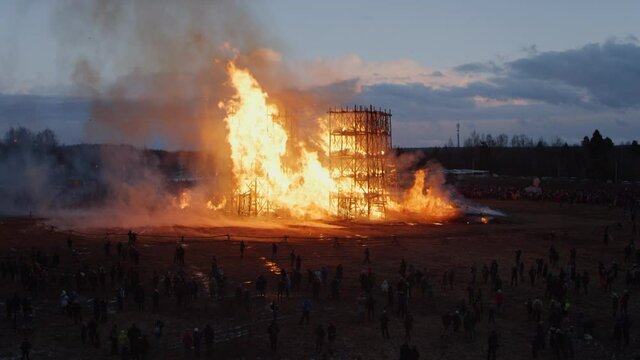 Great wood building in fire from the drone view. Spring aerial flight around massive wood structure in flames. High quality 4k footage