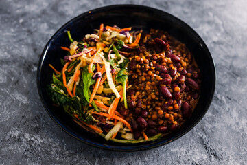 vegan nourish bowls with mexican bean mix and coleslaw salad, healthy plant-based food