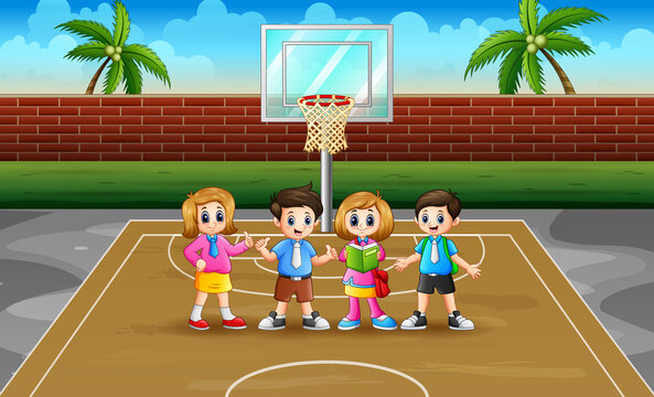 Happy school children in the basketball court	