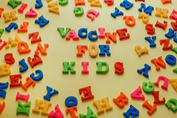 the word vaccine on a yellow background. Vaccination concept