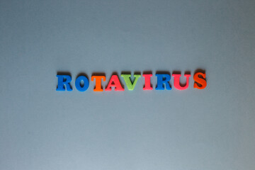 the words kids and rotavirus on a blue background. health concept