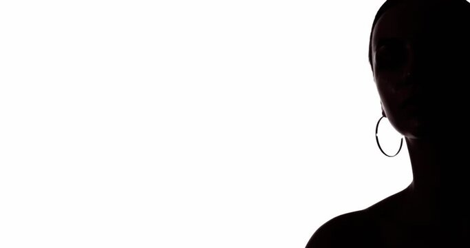 Confident woman silhouette. Female rights. Social banner. Empowerment freedom. Dark contrast outline half face portrait of activist turning head looking at copy space isolated on white background.