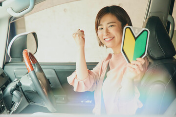 Asian woman driving car portrait