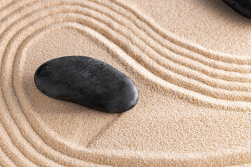 Fototapeta na wymiar Japanese zen garden with stone in raked sand