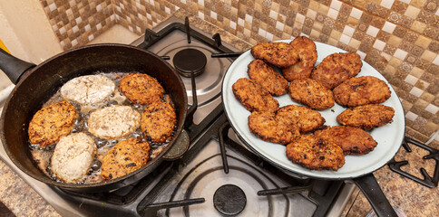 Minced meat cutlets are fried in oil