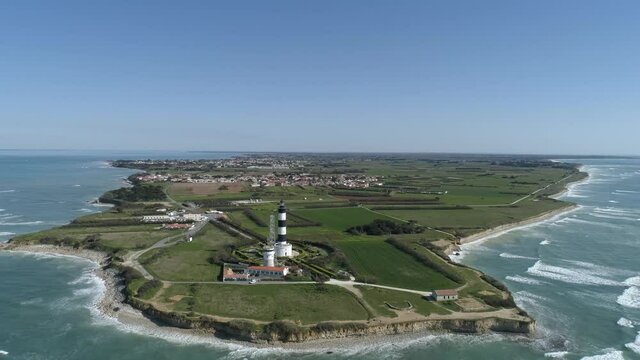 Automated Chassiron lighthouse at North Oleron Island in Western France, Aerial pedestal up shot