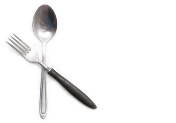 Metal spoon and fork isolated on a white background.