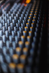 Fototapeta premium Professional audio studio sound mixer console board panel with recording , faders and adjusting knobs,TV equipment.
