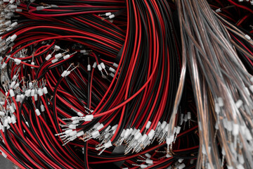 Black and red electrical wire used in telecommunication internet cable network and computer system.