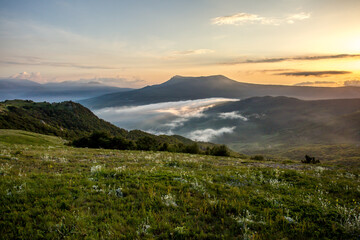 Walking in the mountains.Mount Demerdzhi in the Crimea. Sunset on the mountain. Fog in the mountains.
